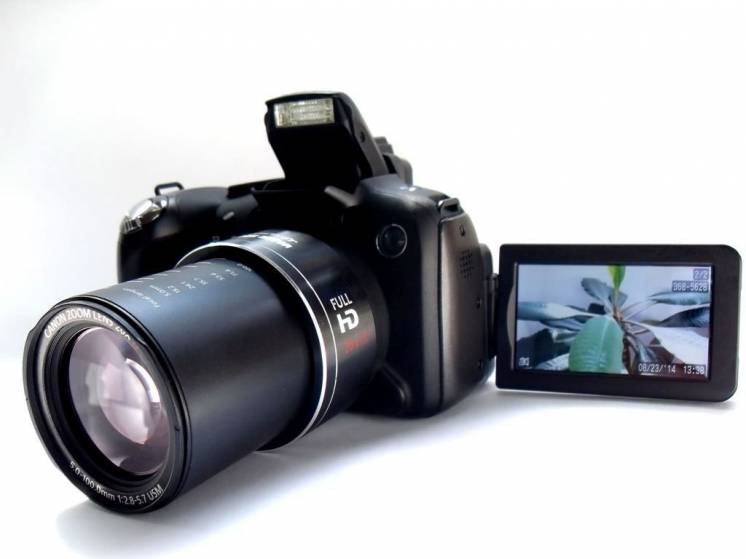 Canon SX1 , СMOS 10 Мп, Full HD