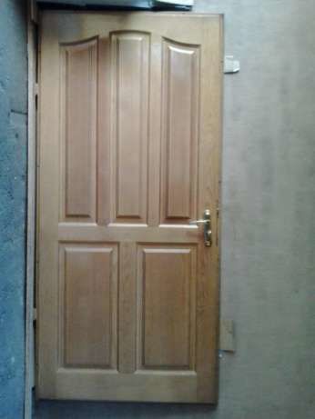 Бронированные двери с деревянными накладками