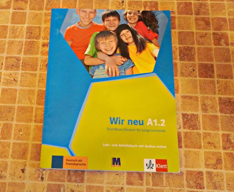 Книга для изучения немецкого -Wir neu A 1.2