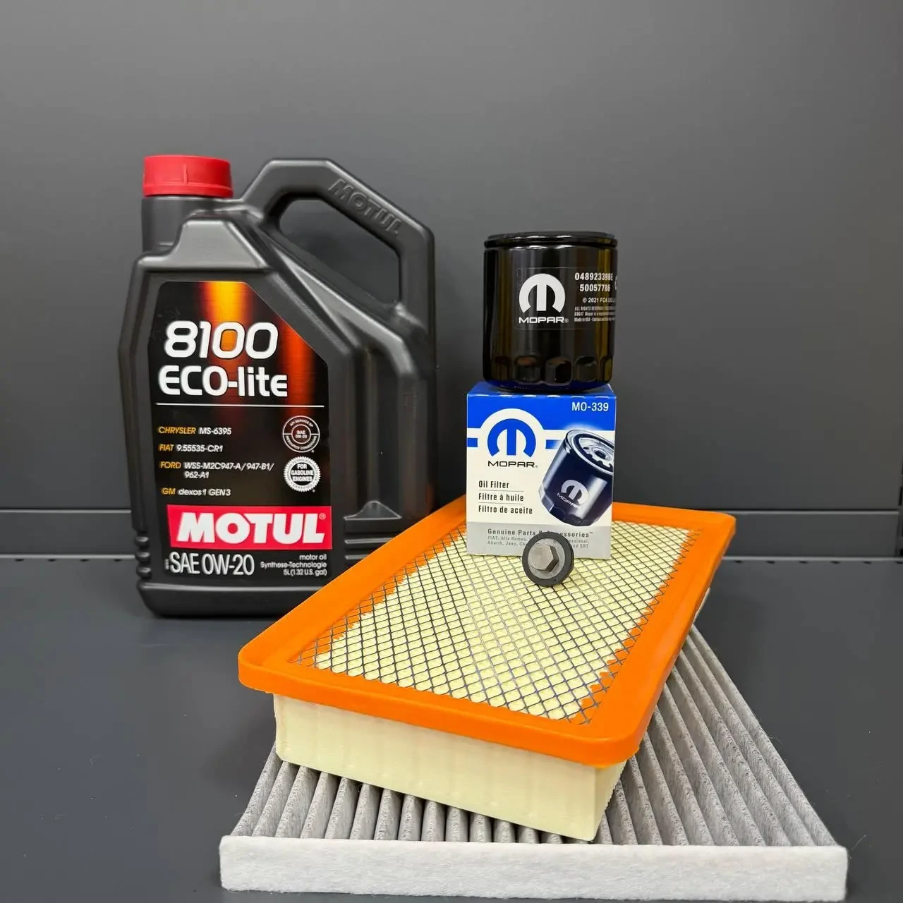 Комплект для ТО MOTUL Eco-Lite 0w20 CHRYSLER 200 2.4 (Масло, фільтр масляний, фільтр повітряний, фільтр салону вугільний, зливна