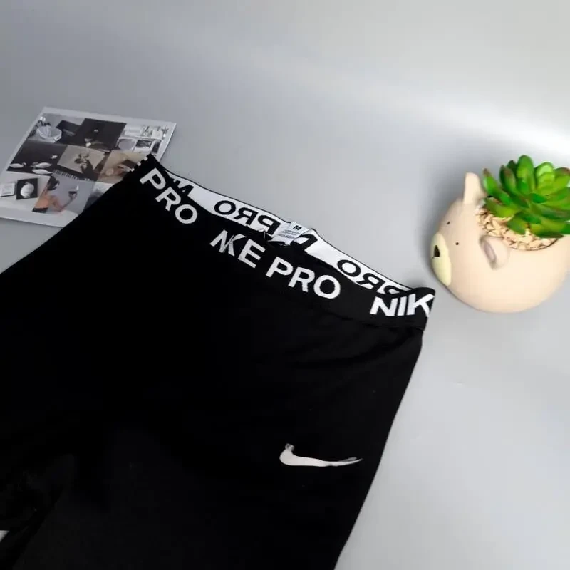 Чорні жіночі лосіни nike 8