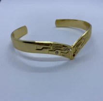 Вінтажний браслет-манжет золотистого кольору у формі v