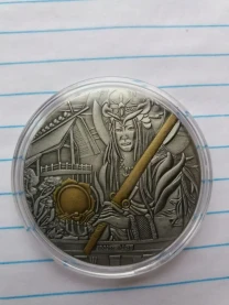 Монета Аматерасу - богині сонця.