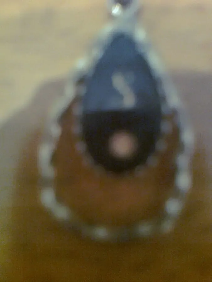 Подвеска из желтого металла, на черной эмали вставка - белый камень 3